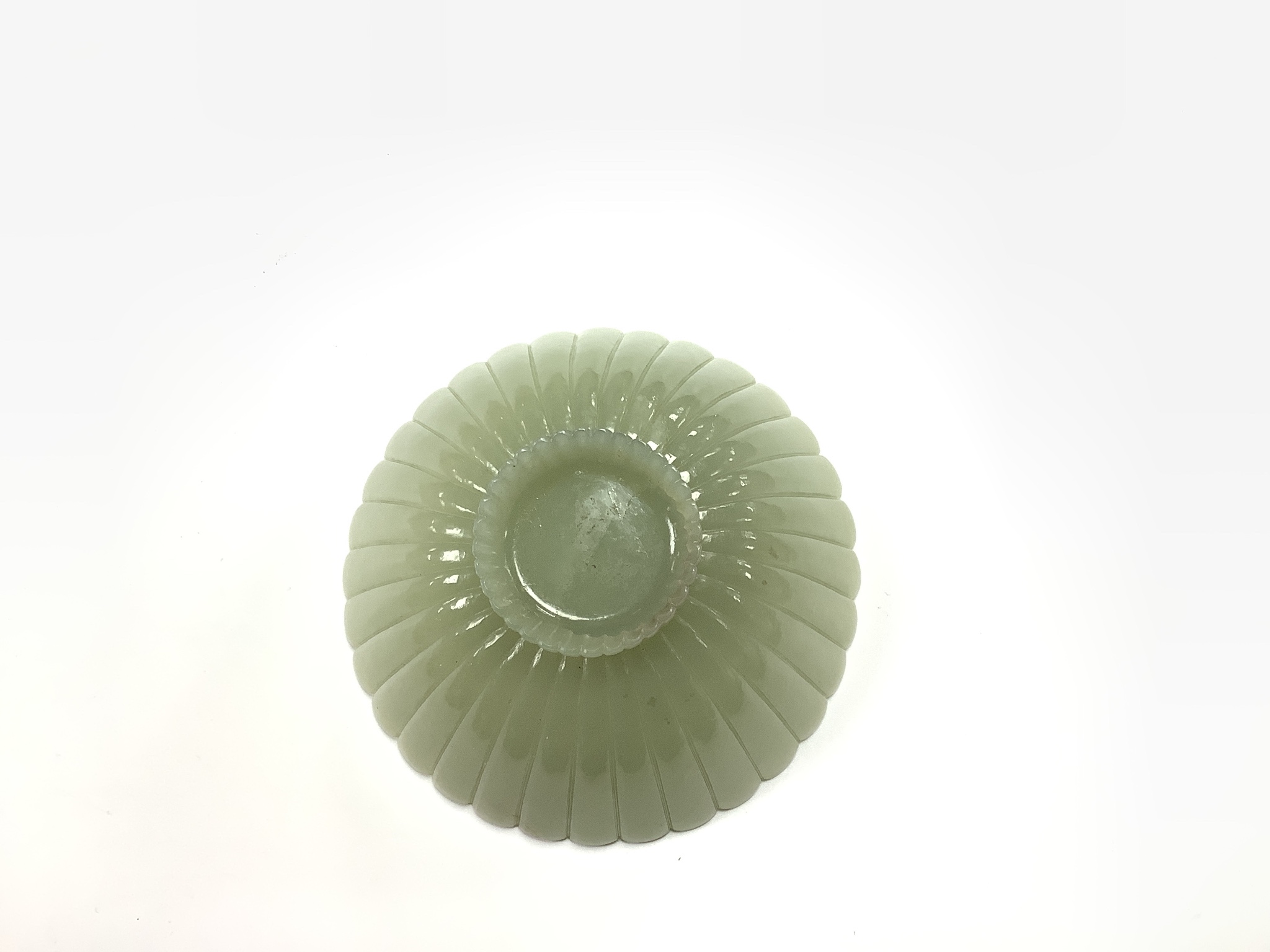 A fine Chinese Mughal style celadon jade ‘chrysanthemum’ bowl, 18th/19th century, 9.4cm diameter
